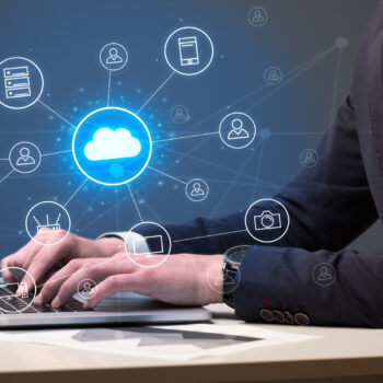 Hand Typing with Cloud Technology System Concept 7 areas of business every company should outsource