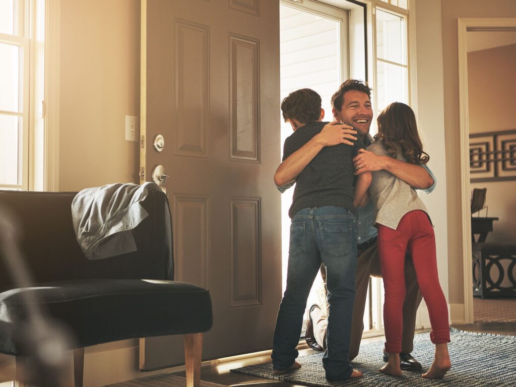 Kidshuggingfather gettyimages 700721656 599ef40f519de200113e4c5c freshly divorced dad these tips can make sure your new home is safe for the kids