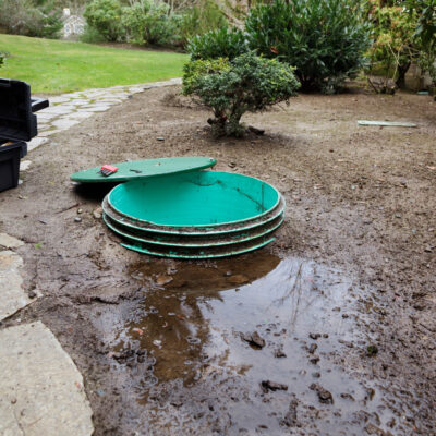 Septic System Problems Opening the Lids to Investigate Leaks Around a Septic Systems Tanks Pump Chamber sump pump installation how to know when to replace your sump pump
