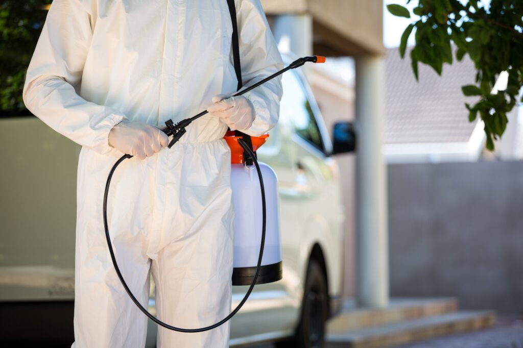 Mid Section of Pest Control Man Standing Next to a Van 5 signs that you need to call pest control immediately