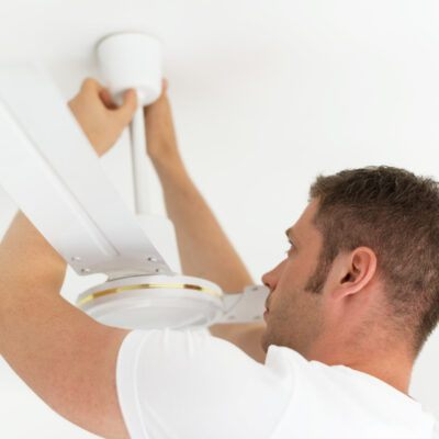 Male Technician Installing Ceiling Fan how to add smart control to your dumb ceiling fans