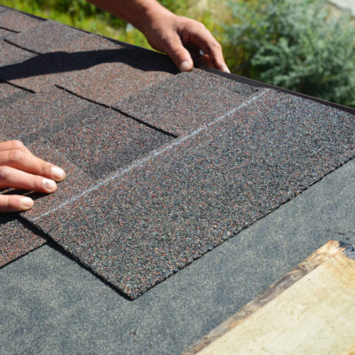 Asphalt Shingles Installation Roofer Contractor Installing Asphalt Shingles on House Roofing Construction what is the average lifespan of a roof and how to extend it