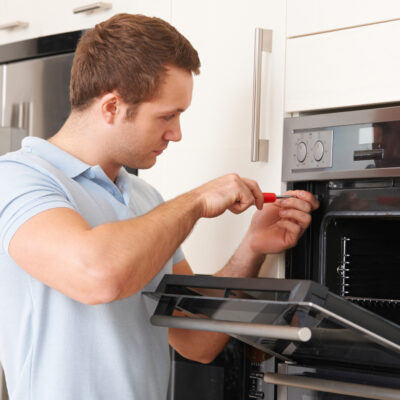 Man Repairing Domestic Oven in Kitchen everything you need to know about appliance repairs