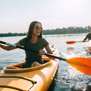 Couple Kayaking Together how to store a kayak a brief guide