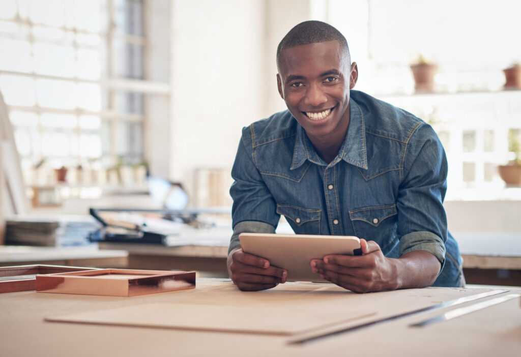 Small Business Owner of African Descent in Studio with Tablet 7things every small business owner needs to know