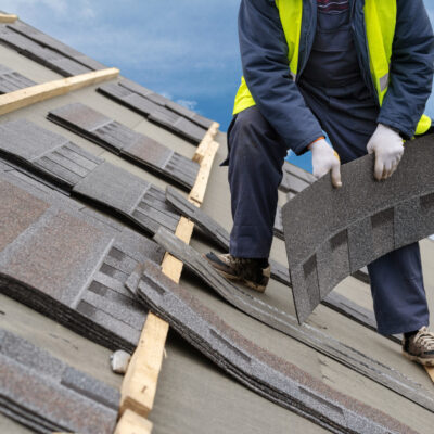 Workman Install Tile on Roof of New House Under Construction roof replacement when is it time for a new roof