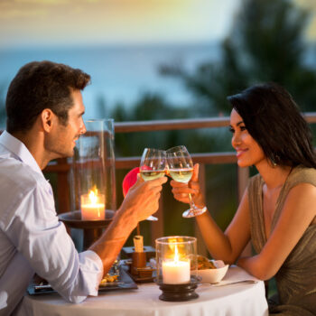 Romantic Couple Toasting During Dinner 4 romantic date planning ideas to create the perfect night