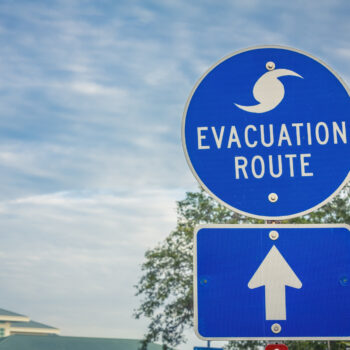 Hurricane Evacuation Route Road Sign on Blue with Arrow how to prepare for a hurricane as a homeowner