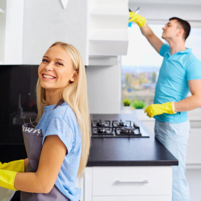 Young Family Couple Doing Cleaning in the House how to keep your home clean with minimal effort